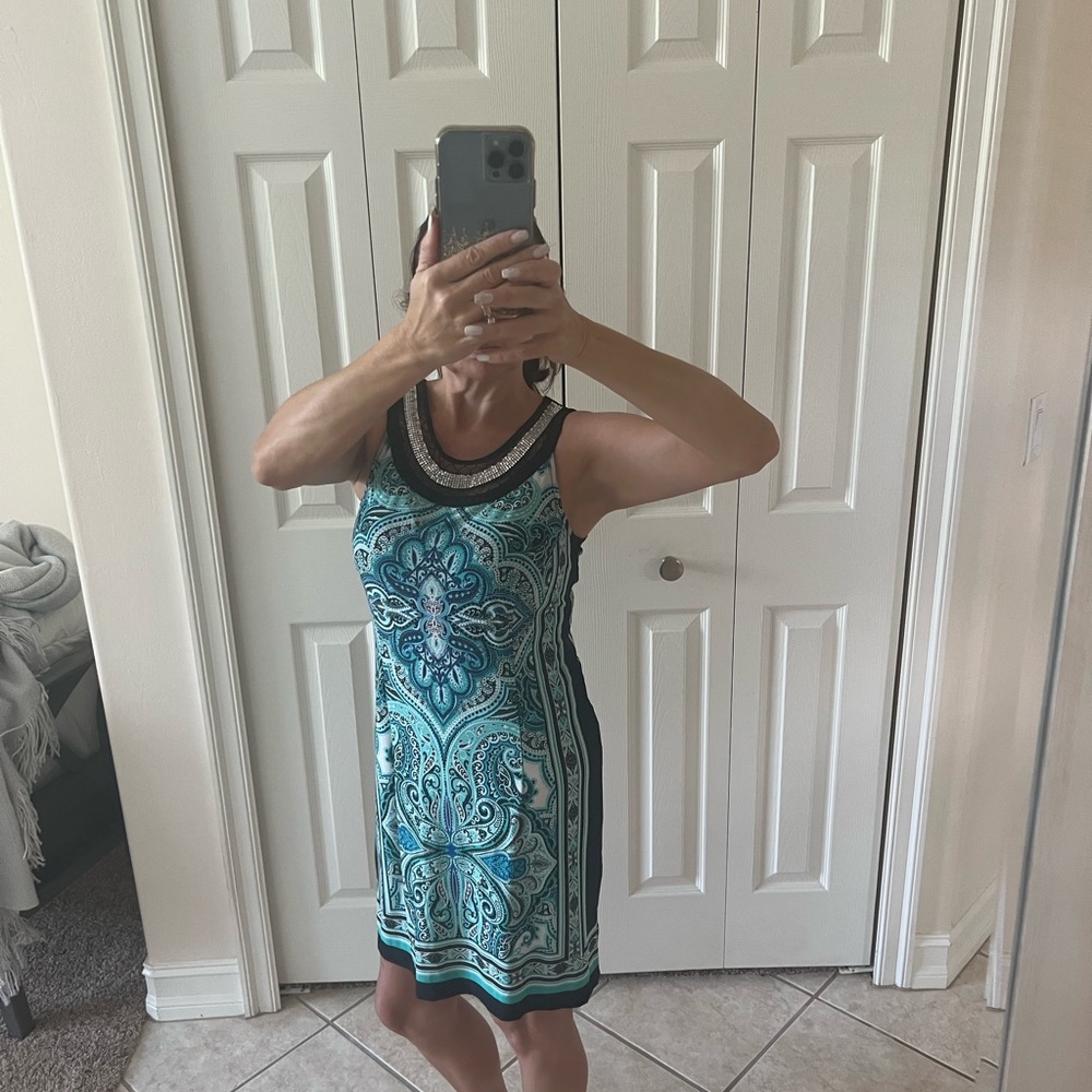 Very flattering dress worn once to a wedding.  Smoke free home.